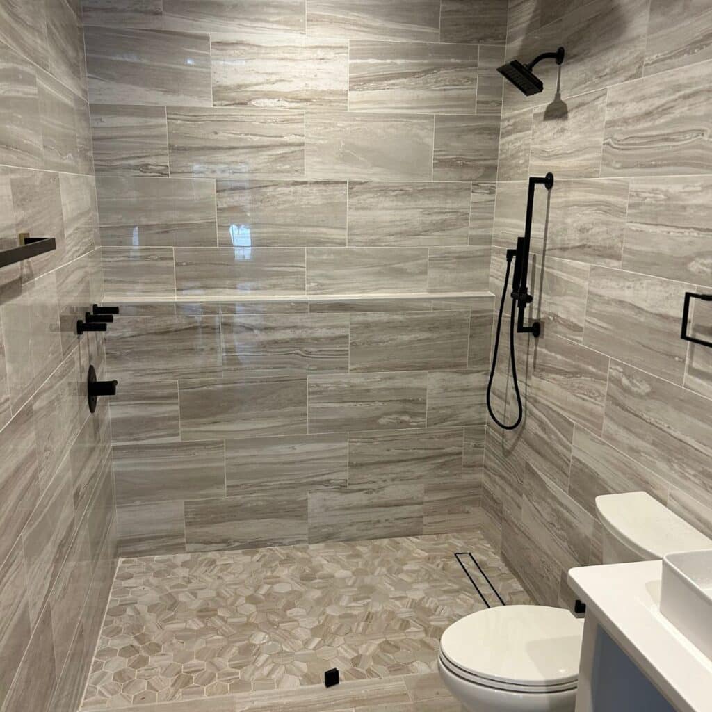 tile shower next to a toilet